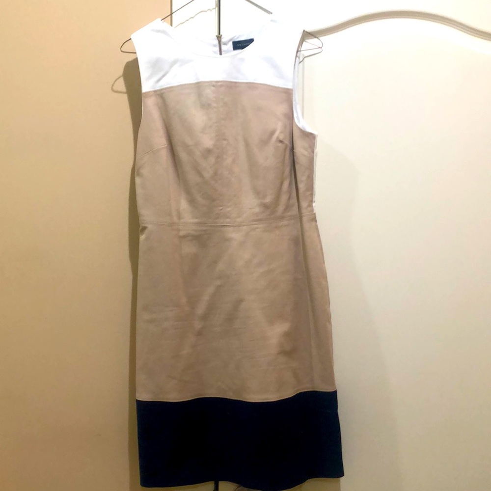Tan, white, and navy dress.